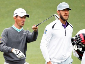 Former Masters champion Mike Weir took on a mentor’s role with Graham DeLaet during practice round at Augusta on Tuesday. (Reuters)