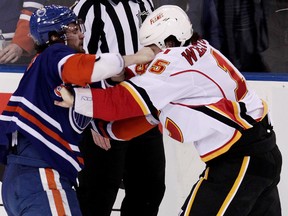 Luke Gazdic, shown here trading punches with Flames brawler Kevin Westgarth, gave the Oilers some added toughness during his first season in the NHL. (David Bloom, Edmonton Sun)