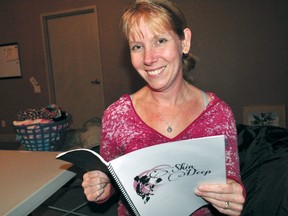 Playwright Trish West holds a copy of her script, Skin Deep, during a rehearsal at the Palace Theatre Feb. 12, 2014. An exploration of body image issues, the play will run at The ARTS project and the Elgin Theatre Guild in April. CHRIS MONTANINI\LONDONER\QMI AGENCY
