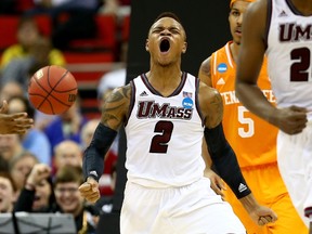 Derrick Gordon of the Massachusetts Minutemen reacts while taking on the Tennessee Volunteers in the second round of the 2014 NCAA Men's Basketball Tournament at PNC Arena on March 21, 2014 in Raleigh, North Carolina. (Streeter Lecka/Getty Images/AFP)