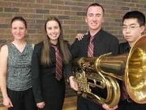 Oakridge music teacher and conductor Deb Wales, left, is joined by grade 12 students Caitlyn Doucette, Chris Cochrane and Andrew Siv at the 54th annual Kiwanis Music Festival.