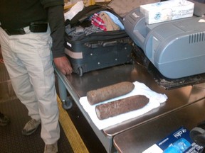 U.S. Transportation Security Administration (TSA) photo shows two military-grade shells in checked baggage at Chicago O'Hare International Airport on April 7, 2014 and released on April 8, 2014. (REUTERS/TSA/Handout via Reuters)
