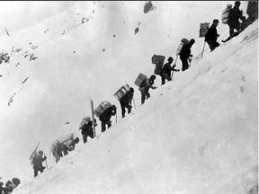 Miners hiking over the Golden Stairs of the Chilkoot Trail, Yukon Territory.
MacBride Museum Collection