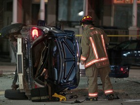 Police were pursuing this car when it rolled on McCaul St. overnight. (JOHN HANLEY/Special to the Sun)