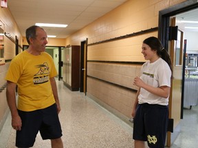 Paul Gauthier shares a laugh with Danika Falvo during track and field practice at College Notre Dame on Wednesday. Gauthier will be inducted into the Sudbury Sports Hall of Fame on June 11.