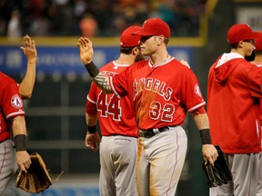 Los Angeles Angels left fielder Josh Hamilton high-fives teammates following a game against the Houston Astros at Minute Maid Park. in Houston, April 5, 2014. (ANDREW RICHARDSON/USA Today)