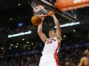 Raptors' Tyler Hansbrough throws down a dunk against the Philadelphia 76ers at the Air Canada Centre on Wednesday. (Stan Behal/Toronto Sun/QMI Agency)