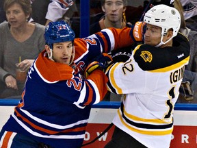 Andrew Ference tangles with Jarome Iginla when the Bruins were in Edmonton in December. (Codie McLachlan, Edmonton Sun)