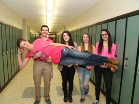 Lockerby Composite School students Roberto Bagnato, left, Cassandra Mazzuca, Kristen Sherrington, Mariangela Bagnato and Brodie Gies-MacNeil wore pink on Wednesday, April 9, 2014 at the Sudbury, ON. high school to recognize Day of Pink, an international day against bullying, discrimination, homophobia and transphobia. JOHN LAPPA/THE SUDBURY STAR/QMI AGENCY