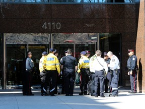 Toronto Police cover the scene at 4110 Yonge St. after a man went on a stabbing spree at an office there. (DAVE THOMAS/Toronto Sun)