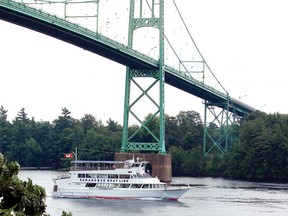 A Gananoque Boat Line cruise boat sails under the 1000 Islands Bridge in this file photo. Recorder and Times file photo