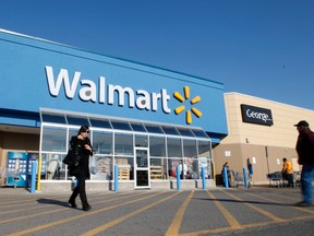 Shoppers walk out of a Walmart in Gatineau QC, Monday, Nov. 19, 2012. (QMI AGENCY/Darren Brown)