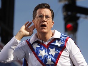 Comedian Stephen Colbert gestures during the "Rally to Restore Sanity and/or Fear" on the National Mall in Washington, October 30, 2010. The rally is a counterpoint to recent partisan political rallies on both ends of the U.S. political spectrum  held in anticipation of the November 2nd Congressional midterm elections.   REUTERS/Jim Bourg