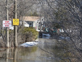 Those who live along the private Rideau Glen Rd. are forced to park their vehicles at the nearby golf course and walk to their homes along the Rideau River, outside Kemptville. However, most have opted to move out until the water recedes.
DOUG HEMPSTEAD/Ottawa Sun