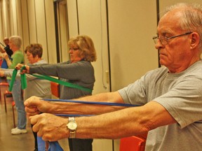 A Forever Fit program, co-ordinated by Lambton Elderly Outreach (LEO) for seniors, is held at the Royal Canadian Legion's Petrolia branch 216 hall Monday, Wednesday and Friday from 9:30 a.m. to 10:30 a.m. Among participants in a program fitness drill with elastic stretch bands on April 9 is Gord Whiting, foreground. The fitness program, led by certified instructor Mike Parsons, is funded by the Ministry of Health and Long-Term Care. For more information, contact LEO at 519-845-1353.
DAVID PATTENAUDE / THE PETROLIA TOPIC