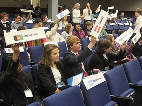Delegates from countries around the world, played by high school students, vote on a motion during the Model UN at KCVI. A main topic of debate was the Russian incursion into Crimea.
Michael Lea The Whig-Standard