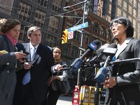 Toronto mayoral candidate Olivia Chow holds a press conference about traffic gridlock at the corner of Wellington and York Sts on April 10, 2014. (Veronica Henri/Toronto Sun)