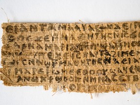 The front of a papyrus fragment called the Gospel of Jesus' Wife. It contains the words, "Jesus said to them, my wife." On April 10, 2014, Harvard University researcher Karen King said testing has shown the fragment is not a forgery and dates back to sometime between the sixth and ninth centuries. (Karen L. King/Handout/QMI Agency)