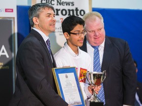Jonathan Dart, British Consul General in Toronto (left) and Toronto Mayor Rob Ford pose for a photo with Valley Park M.S. student Hamza Talal at Cabbagetown Youth Centre on April 10, 2014. (Ernest Doroszuk/Toronto Sun)