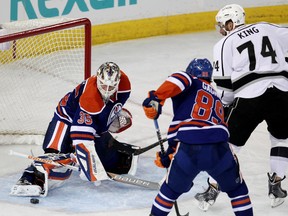 Viktor Fasth makes a save against Kings Dwight King during second-period action at Rexall Place Thursday. (David Bloom, Edmonton Sun)