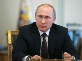 Russia's President Vladimir Putin chairs a meeting with members of the Security Council at the Novo-Ogaryovo state residence outside Moscow, April 11, 2014.  REUTERS/Mikhail Klimetyev/RIA Novosti/Kremlin