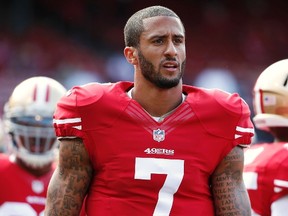 Niners QB Colin Kaepernick is being investigated by Miami police after a woman filed a police report claiming that she had drinks with him and two other football players and awoke in a hospital with no memory of the night.  (Stephen Lam/Reuters/Files)