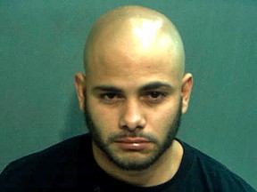 Robert Corchado, 28, is seen in a booking photo from the Orange County Jail in Orlando, Florida taken April 10, 2014.(REUTERS/Orange County Jail/Handout via Reuters)