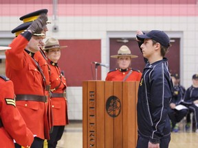 Dylan Sherman salutes an RCMP officer during the Youth Academy graduation ceremony held in St. Albert on April 3. Sherman, along with two other Grade 12 Spruce Grove students attended the week’s boot camp to learn about potential careers in the RCMP. - Karen Haynes, Reporter/Examiner