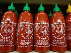 Bottles of Sriracha hot chili sauce, made by Huy Fong Foods, are seen on a supermarket shelf in San Gabriel, Calif., in this October 30, 2013 file photo. (REUTERS/Lucy Nicholson/Files)