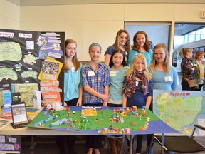 These Grade 6 students from Blueberry School took home first place at the Parklandia Fair on April 9. Counterclockwise from left: Brooklyn Hemeyer, Madison Pusch, Tigan Northcott, Hannah O’Brien, Sydney Ward, Kali Kwasnycia, Tennia Womacks show off their creation, a community called Wopkwn Land. - April Hudson, Reporter/Examiner