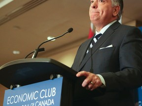 Ontario Finance Minister Charles Sousa address an Economic Club of Canada luncheon in Toronto on April 11, 2014. (Veronica Henri/Toronto Sun)