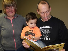 Author Jen Dafoe shares her new children's book with friends Cam Davies and Jace Bettridge, 2, in Sarnia, Ont. Thursday, April 10, 2014. Dafoe was inspired by Davies to write "Chico's First Trip to the Dentist." (BARBARA SIMPSON, The Observer)