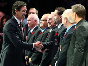 Brendan Shanahan is welcomed by the Hall of Fame inductees before action between the Toronto Maple Leafs and the New Jersey Devils at the Air Canada Centre in Toronto on November 8, 2013. (Dave Abel/Toronto Sun/QMI Agency)