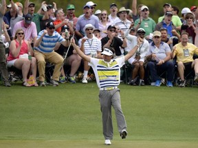 Bubba Watson reacts after making a birdie putt on the 14th green during the second round of the Masters at Augusta National Golf Club on April 11, 2014. (AFP PHOTO/Timothy A. CLARY)