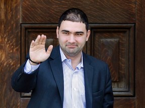 Dimitri Soudas waves as he leaves the Langevin Block in Ottawa in this June 15, 2010 file photo. (REUTERS/Chris Wattie)