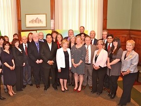 Attorney General Madeleine Meilleur (centre) and legislative colleagues John Gerretsen, Michael Gravelle, Jeff Leal, Yasir Naqvi and John Yakabuski, with recipients of the 2014 Attorney General’s Victim Services Awards of Distinction at a ceremony at Queen’s Park.