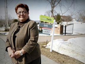 Real Estate Broker Lorraine Goulard in front of one of her large property listings in Cumberland. April 10, 2014. Errol McGihon/Ottawa Sun/QMI Agency