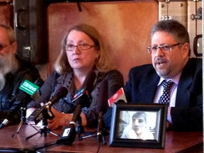 Suzanne Baker and her husband Danny are joined by their lawyer Russel Molot (right) Friday, April 11, 2014 at a presser announcing a class action suit against General Motors. Their son Nick Baker died in a car crash in 2012 in a vehicle in which the airbag didn't deploy.
SOPHIE DESROSIERS/Ottawa Sun/QMI AGENCY