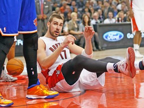 Raptors centre Jonas Valanciunas hits the floor during Friday night's game against New York. (STAN BEHAL/Toronto Sun)