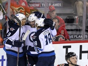 The Jets held on to beat Calgary in their final game of the season. (MIKE DREW/QMI Agency)