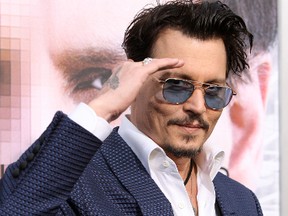 Johnny Depp attends the premiere of "Transcendence" at the Regency Theater in Weestwood, Calif., on April 11, 2014. (FayesVision/WENN.com)