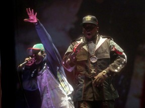 Rappers Andre 3000 (L) and Big Boi of OutKast perform onstage during day 1 of the 2014 Coachella Valley Music & Arts Festival at the Empire Polo Club on April 11, 2014 in Indio, Calif.  (Karl Walter/Getty Images for Coachella/AFP)
