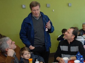 Toronto mayoral candidate John Tory speaks with potential voters in Etobicoke on April 12, 2014. (Shawn Jeffords/Toronto Sun)
