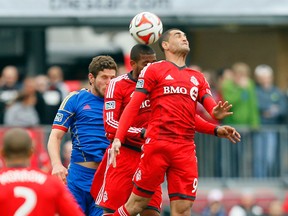 TFC's Gilberto (front) and Jeremy Hall compete for a ball against Colorado's Dillon Powers on Saturday. (USA TODAY SPORTS)