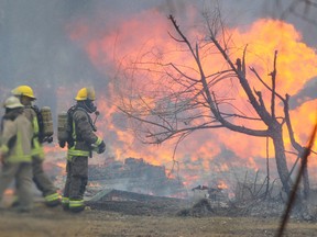 A home that was the scene of a homicide last month was set ablaze today, in what police are calling a "controlled burn".  Saturday, April 12, 2014. (Chris Procaylo/Winnipeg Sun/QMI Agency)