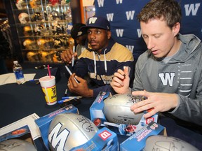 Drew Willy (right) is one of four quarterbacks attending the Bombers mini-camp in Florida.
