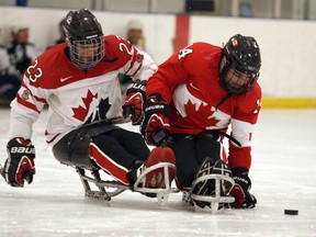 Canadian National Sledge hockey players Steve Arsenault, right, and Kieran Block take part in a game of shinny during the last hour of the annual 24-Hour Charity Challenge for the Matt Cook Foundation at the Canadian Athletic Club Arena, 14640-142 St., in Edmonton, AB  on Saturday, April 12, 2014. Trevor Robb/Edmonton Sun/QMI Agency