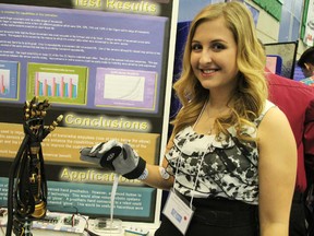 Melissa Chopcian, 17, moves the fingers of a robotic hand she built using sensors, a demonstration of her entry at the 41st annual Lambton County Science Fair. Chopcian won best of fair honours. TYLER KULA/ THE OBSERVER/ QMI AGENCY