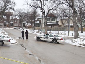 A large police presence at the scene of an apparent shooting in the 400-block of Pacific Avenue near Ellen Street on Sat., April 12, 2014. One person was rushed to hospital. (Kevin King/Winnipeg Sun/QMI Agency)