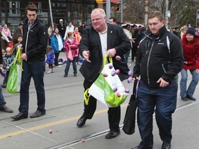 Toronto Mayor Rob Ford hands out Easter eggs during the 2013 Beach Easter Parade. (Dave Thomas/Toronto Sun)